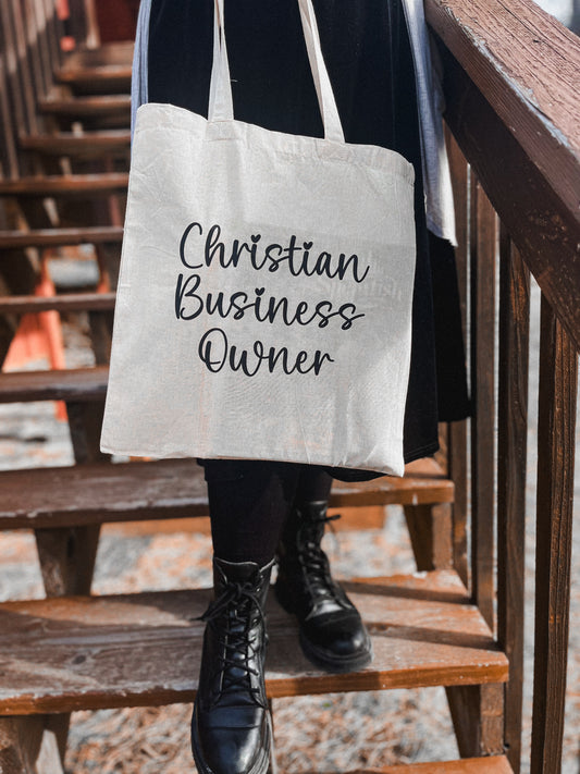 tan tote bag with christian business owner on it.